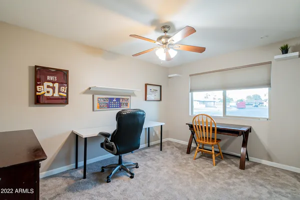 a bathroom with a black and white checkered floor