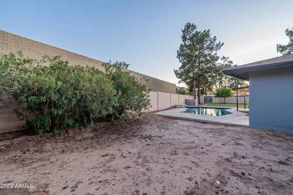 a view of swimming pool with a chair