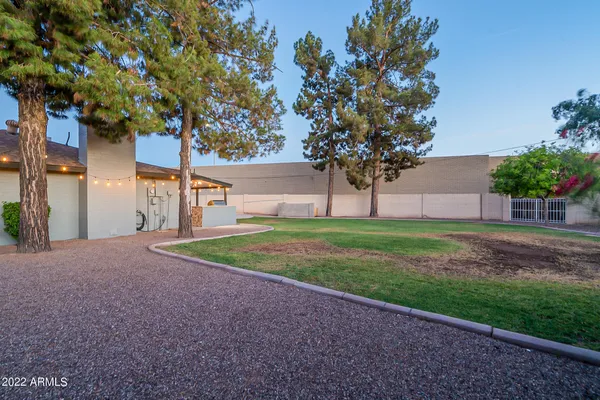 a view of a house with a yard and garage
