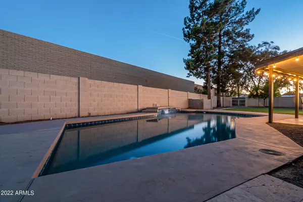 a view of a house with a yard and garage