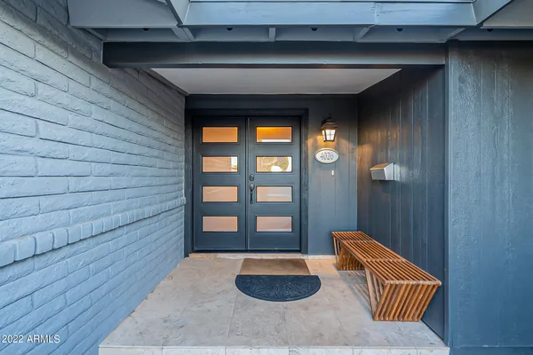 a living room with furniture and a rug