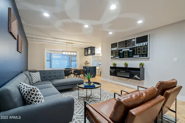 a view of a dining room with furniture and wooden floor