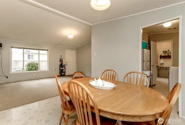 a view of a dining room and livingroom with furniture