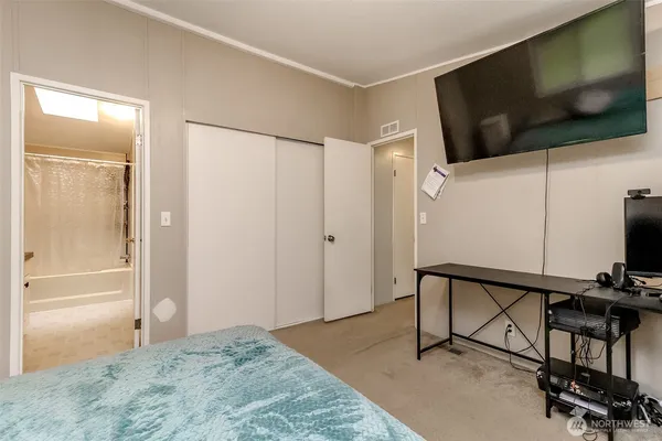 a view of a livingroom with furniture and a flat screen tv