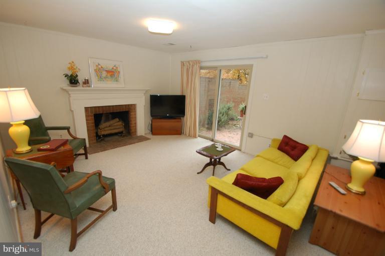 8311 Garfield Court Springfield, VA 22152 - Photo 3 of 21 Recreation Room with wood burning fireplace