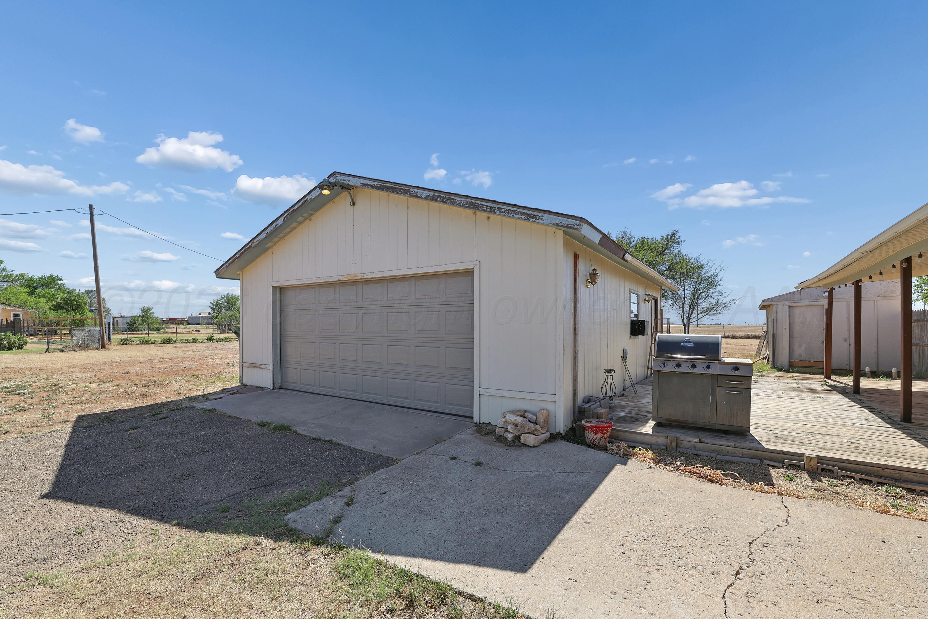 14200 Savannah Road Amarillo, TX 79118 - Photo 28 of 34 a view of a house with a backyard