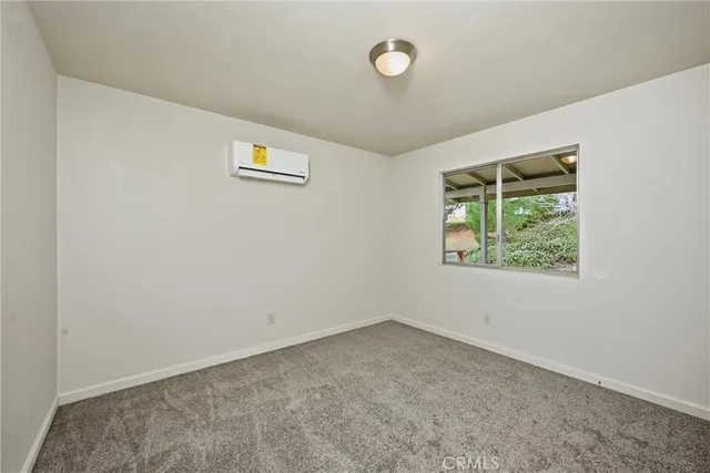 a bathroom with a sink toilet a mirror and shower