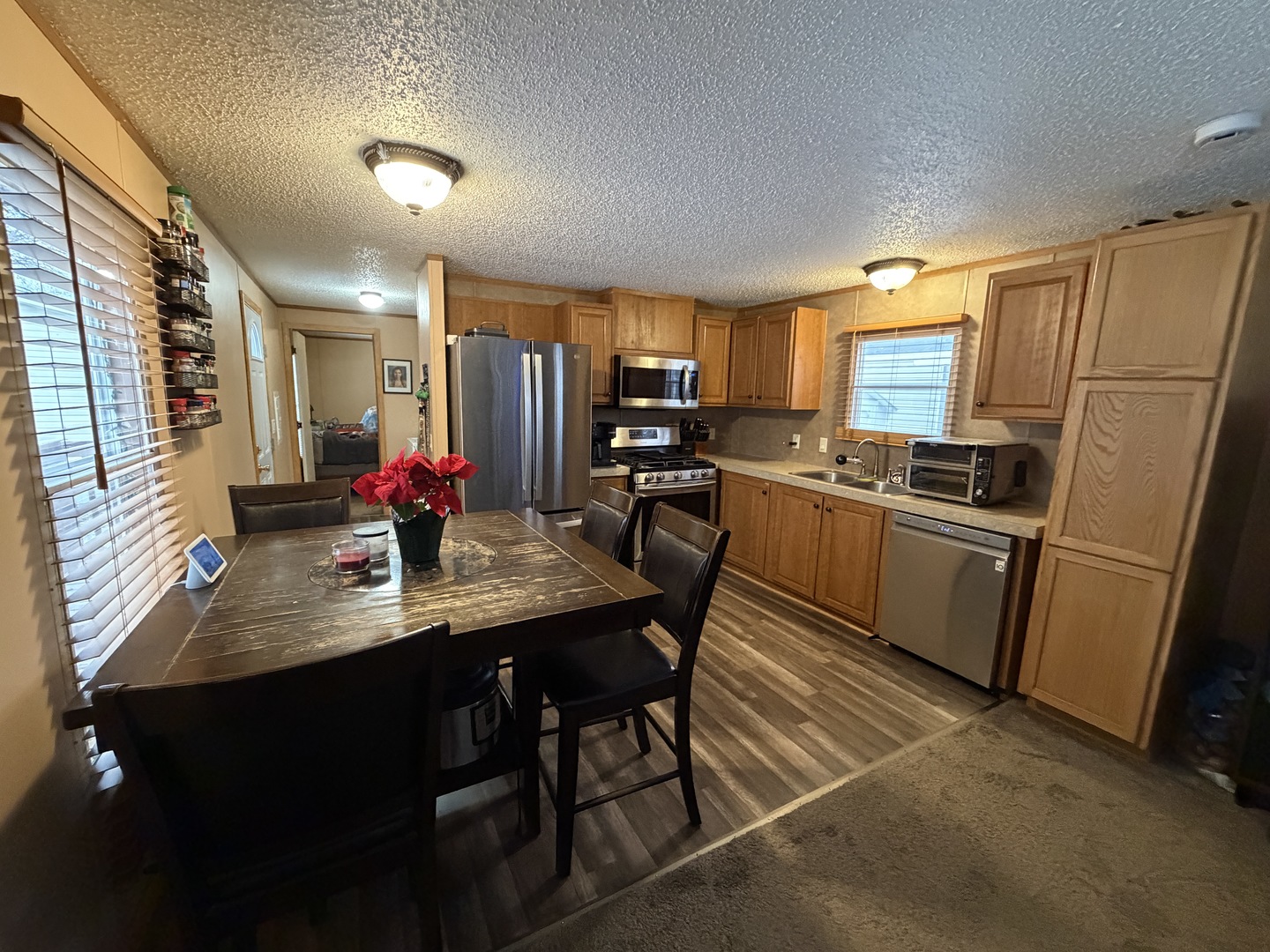 35 Cedar Street Minooka, IL 60447 - Photo 2 of 10 a kitchen with granite countertop a sink stainless steel appliances and cabinets