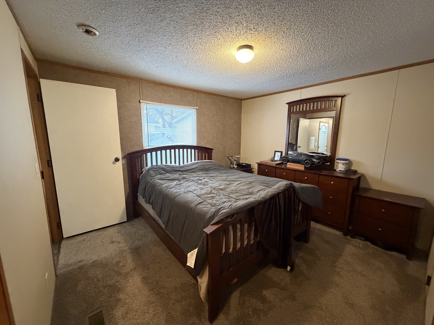 35 Cedar Street Minooka, IL 60447 - Photo 5 of 10 a bedroom with a bed and wooden floor