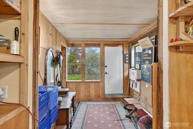 a view of an entryway with furniture and front door
