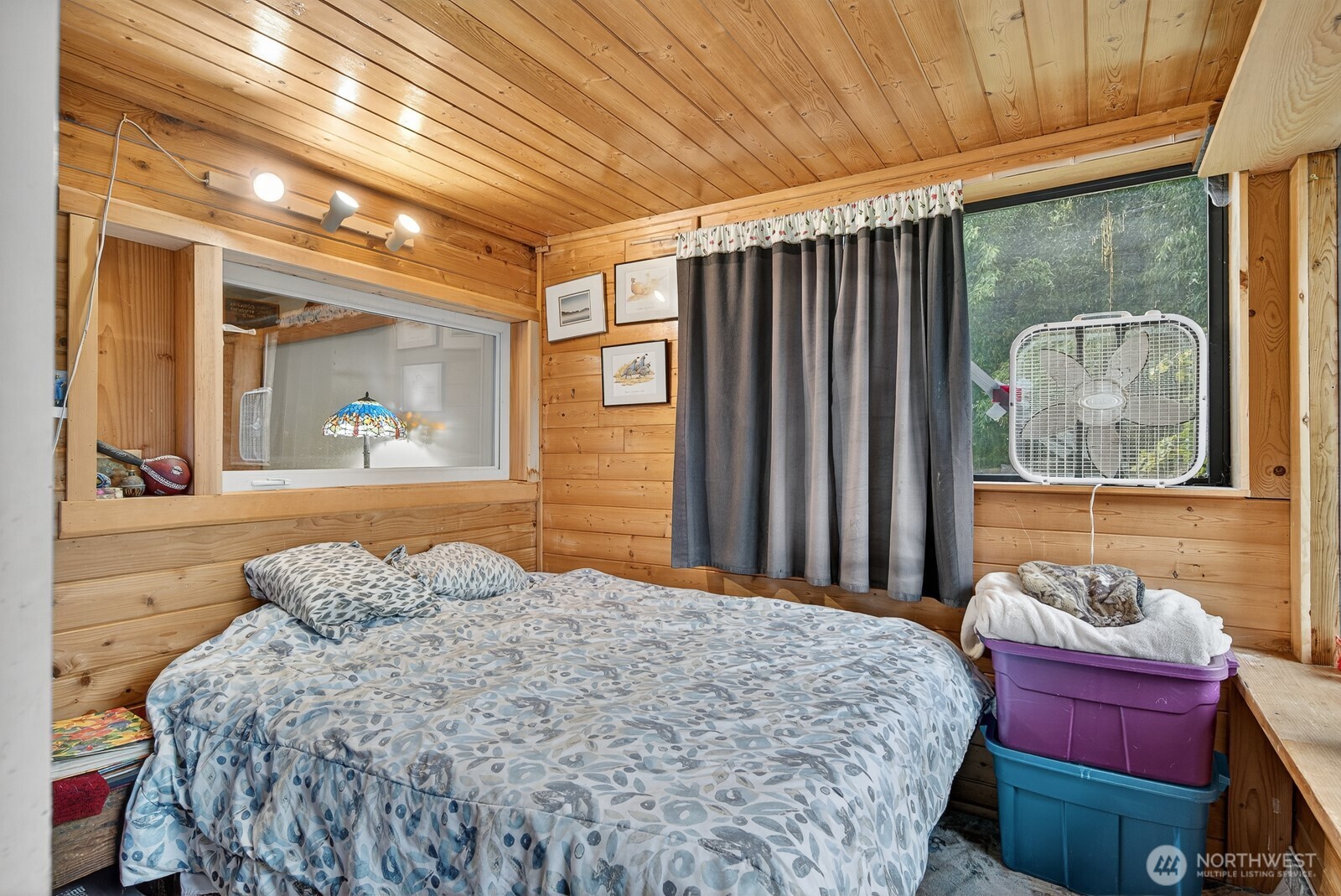 7554 Nooksack Road Everson, WA 98247 - Photo 25 of 40 a bedroom with a bed and a painting on the wall
