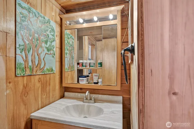 a bathroom with a sink and a mirror