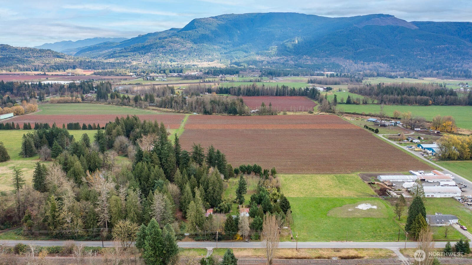 7554 Nooksack Road Everson, WA 98247 - Photo 37 of 40 an aerial view of residential houses with outdoor space and river