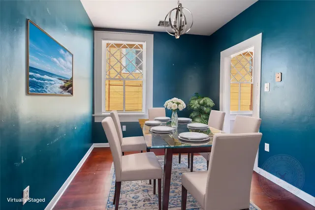 a view of a dining room with furniture window and outside view