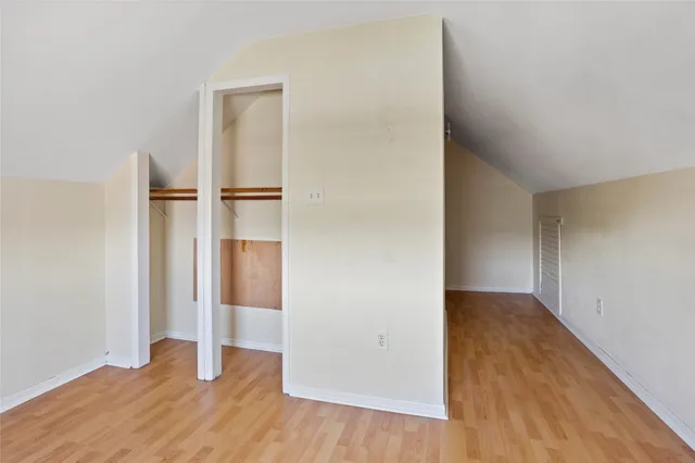 an empty room with wooden floor