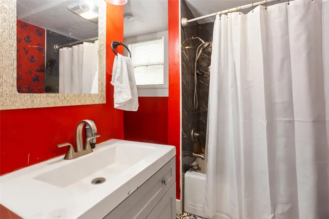 a bathroom with a sink and mirror
