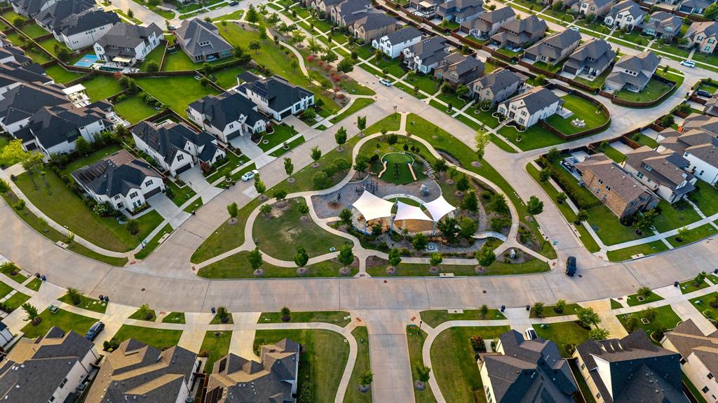 7852 Buffaloberry Road Frisco, TX 75035 - Photo 35 of 36 Aerial perspective of a developed residential community featuring single-family homes with dark roofs and light-colored exteriors