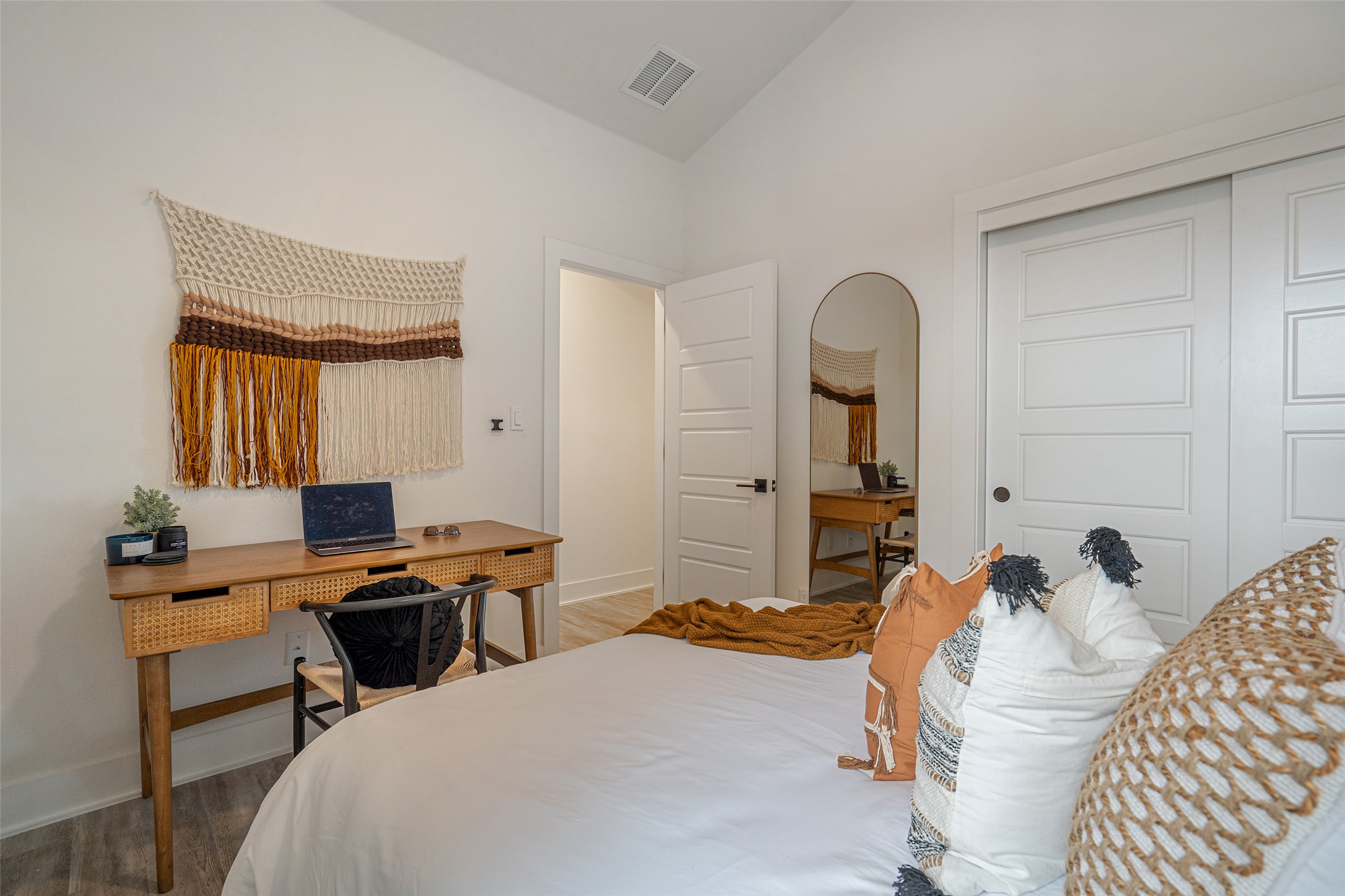 21202 Boggy Ford Road, Unit 6 Lago Vista, TX 78645 - Photo 20 of 36 a bedroom with a bed and a desk