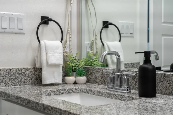 a close view of light fixtures and a sink