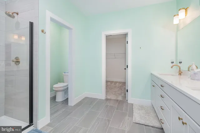 a bathroom with a double vanity sink and mirror