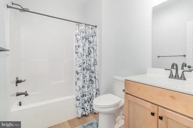 a view of a entryway and wooden floor