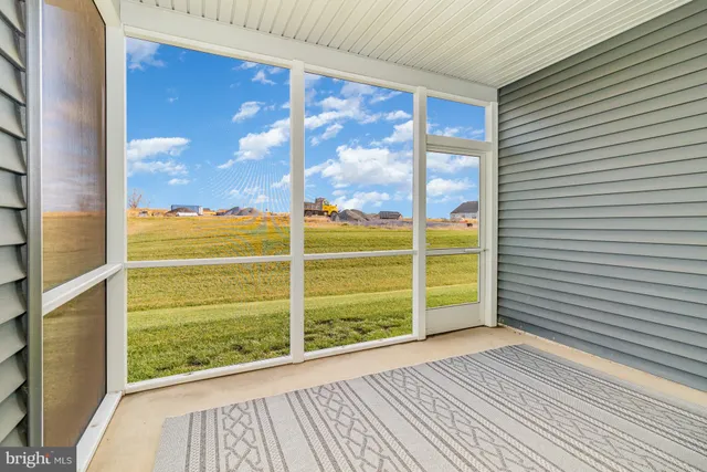 a view of a patio with a yard