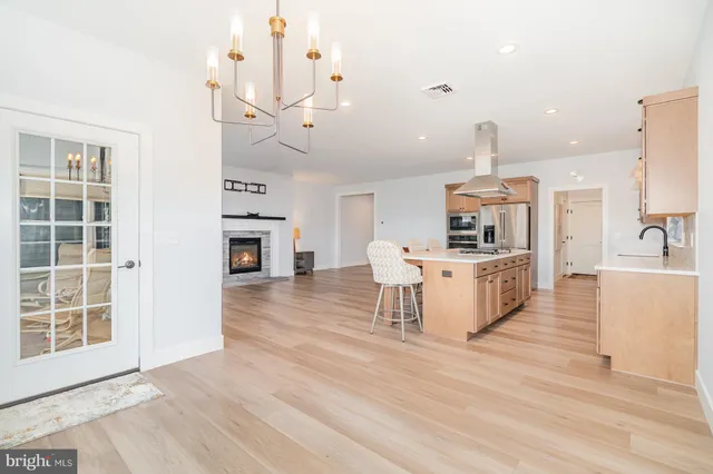 a kitchen with a sink stove and refrigerator