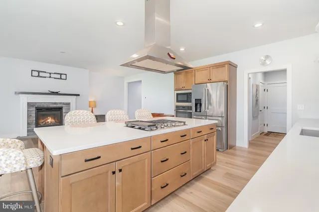 a kitchen with a sink and a stove top oven