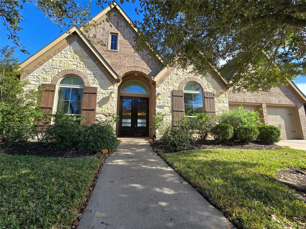 4311 Piper Shadow Lane Katy, TX 77494 - Photo 1 of 29 a front view of a house with a yard