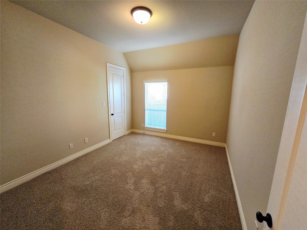 4311 Piper Shadow Lane Katy, TX 77494 - Photo 15 of 29 an empty room with windows and closet