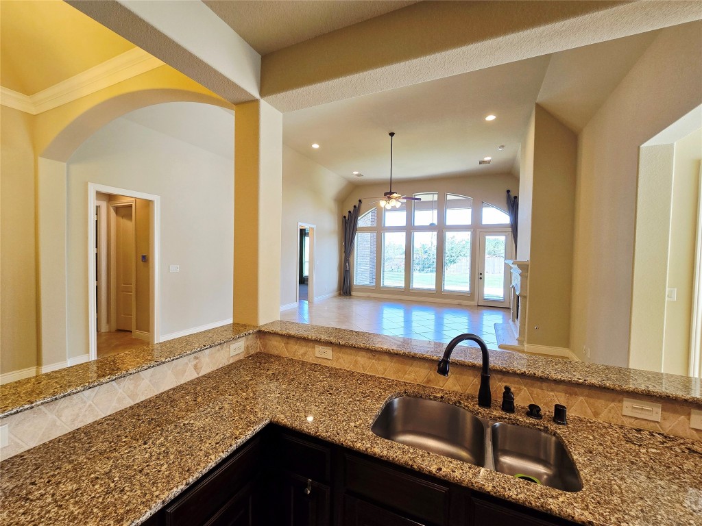4311 Piper Shadow Lane Katy, TX 77494 - Photo 20 of 29 a kitchen with granite countertop a sink and a window