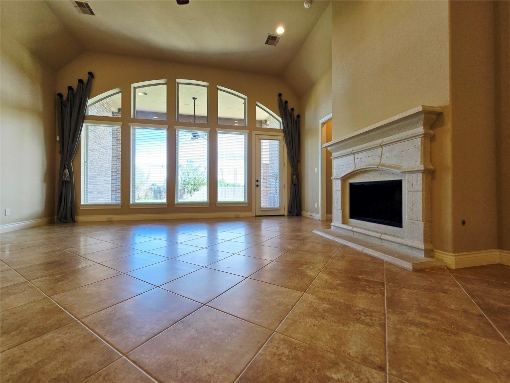 4311 Piper Shadow Lane Katy, TX 77494 - Photo 21 of 29 a view of an empty room with a fireplace and a window
