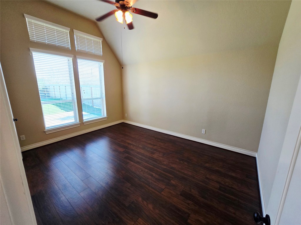 4311 Piper Shadow Lane Katy, TX 77494 - Photo 23 of 29 wooden floor in an empty room with a window