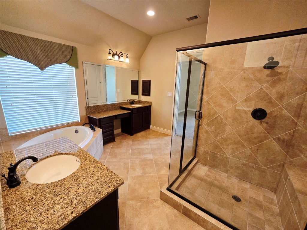 4311 Piper Shadow Lane Katy, TX 77494 - Photo 26 of 29 a bathroom with a granite countertop sink toilet and shower
