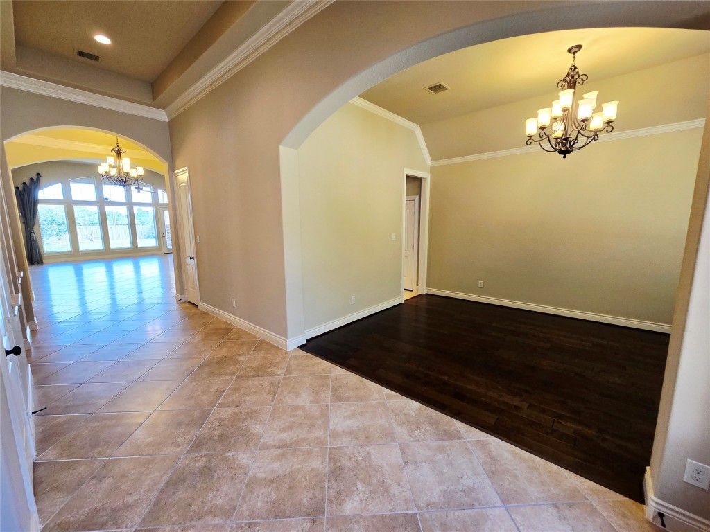 4311 Piper Shadow Lane Katy, TX 77494 - Photo 5 of 29 wooden floor in an empty room with a window