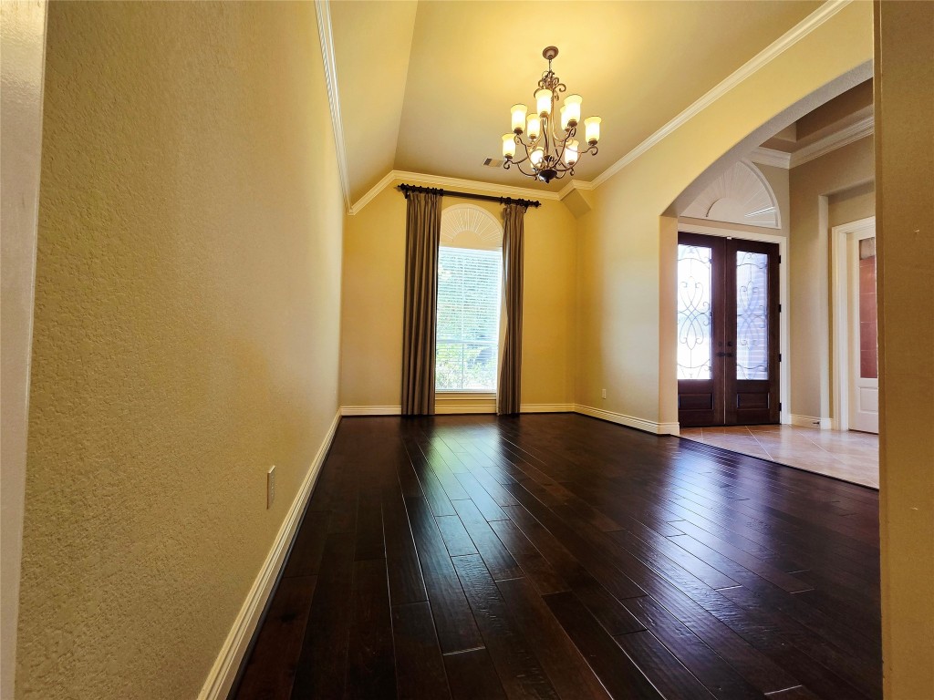 4311 Piper Shadow Lane Katy, TX 77494 - Photo 6 of 29 a view of a room with wooden floor and chandelier