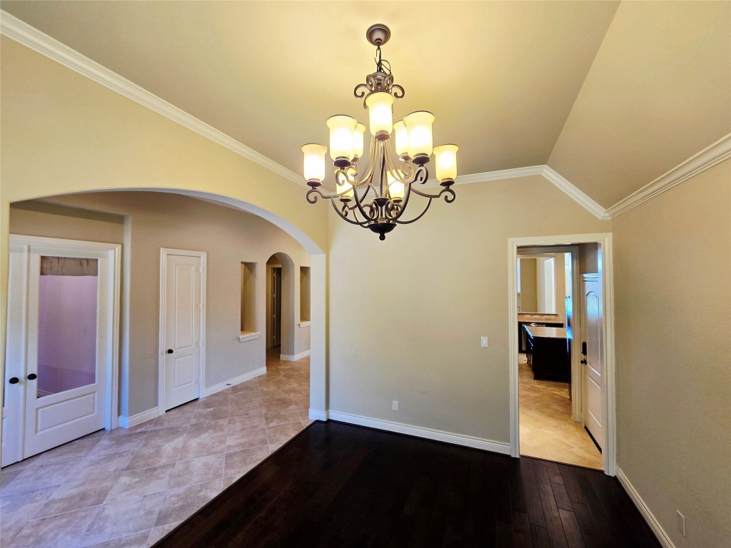 4311 Piper Shadow Lane Katy, TX 77494 - Photo 7 of 29 a view of a room with wooden floor chandelier and closet