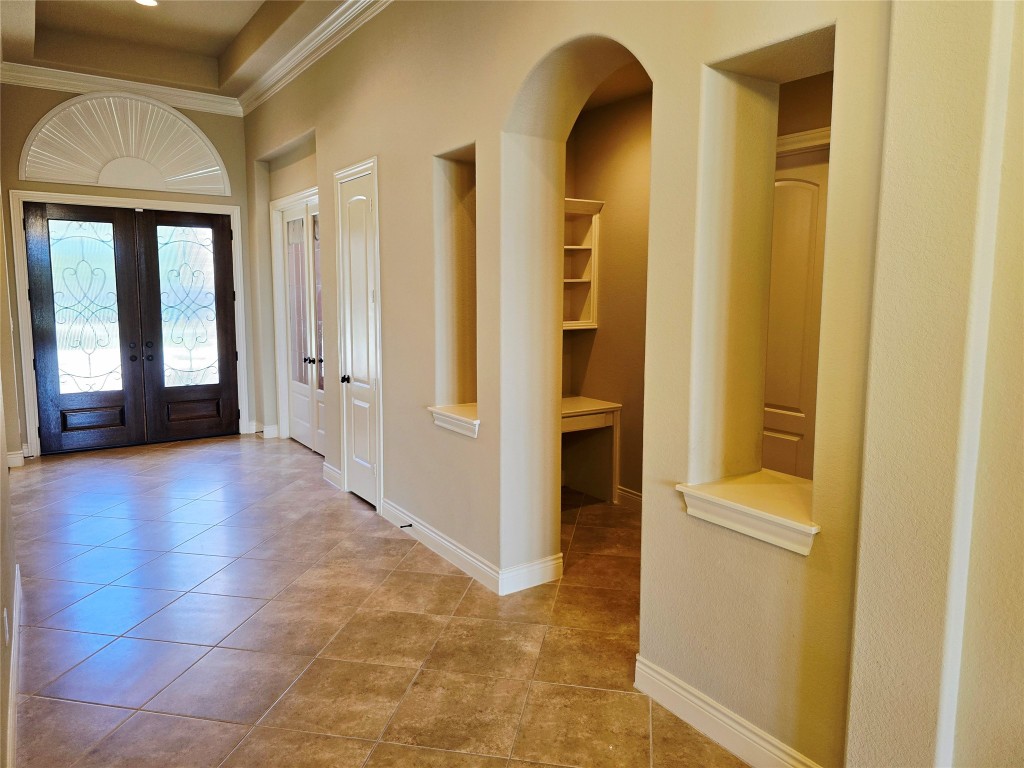4311 Piper Shadow Lane Katy, TX 77494 - Photo 8 of 29 a view of a hallway with wooden shelves