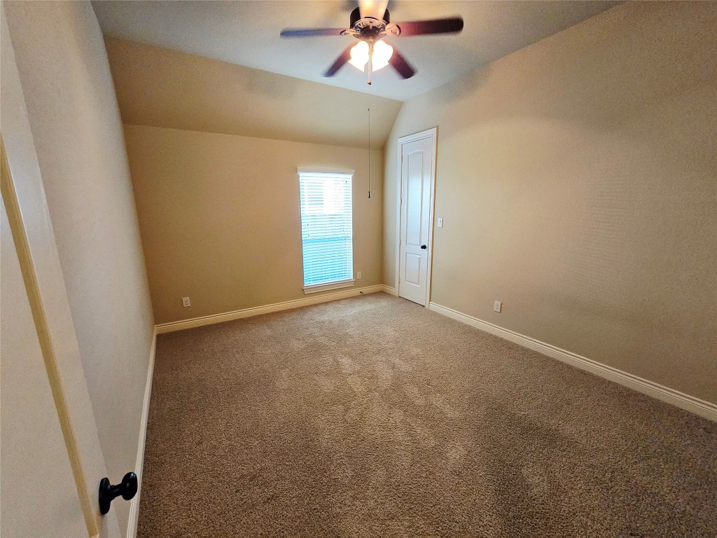 4311 Piper Shadow Lane Katy, TX 77494 - Photo 10 of 29 a view of an empty room and a ceiling fan
