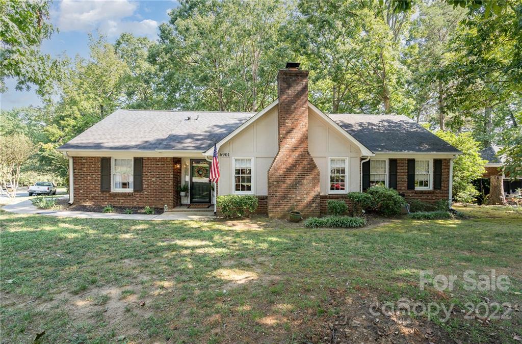 6901 Porterfield Road Charlotte, NC 28226 - Photo 1 of 30 a front view of a house with a garden