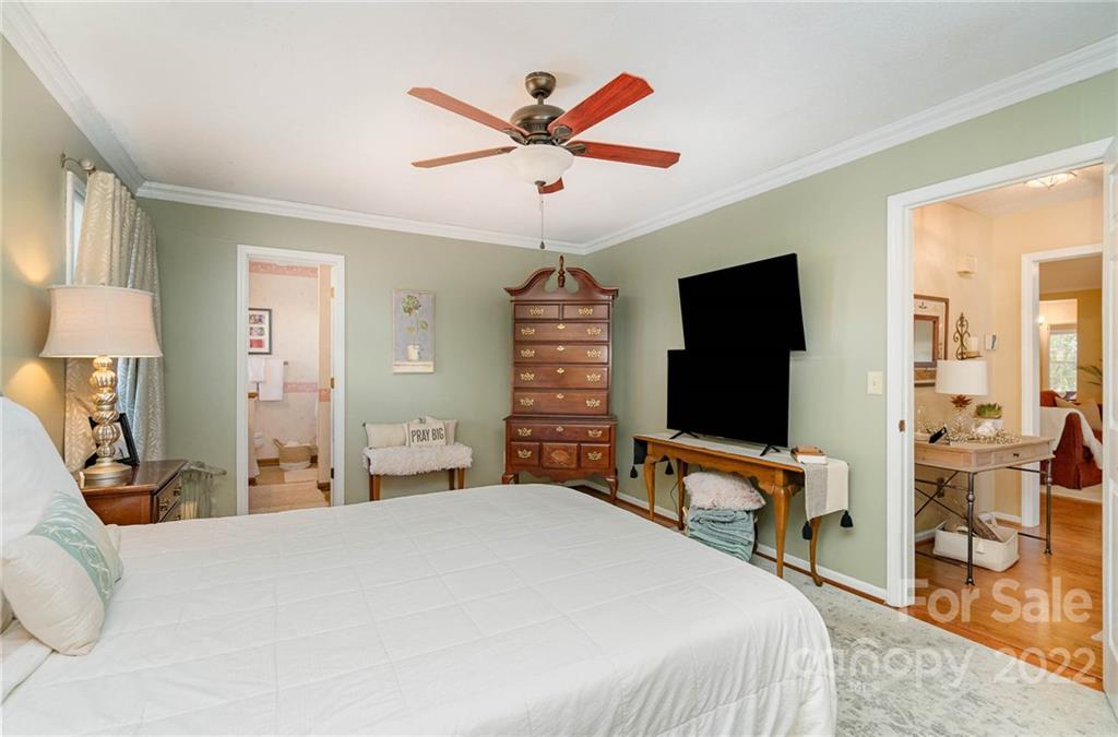 6901 Porterfield Road Charlotte, NC 28226 - Photo 19 of 30 a bedroom with a bed and a flat screen tv