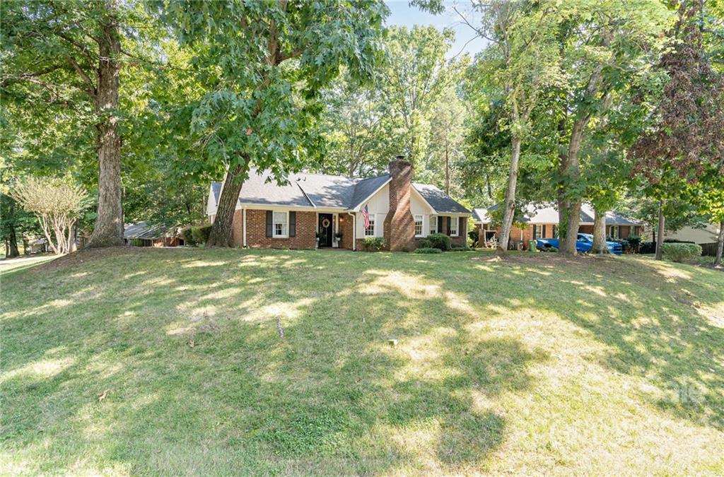 6901 Porterfield Road Charlotte, NC 28226 - Photo 2 of 30 a view of a house with a big yard and large trees