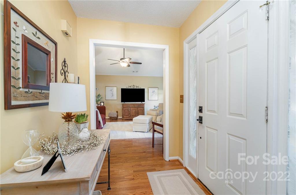 6901 Porterfield Road Charlotte, NC 28226 - Photo 22 of 30 a living room with furniture and wooden floor