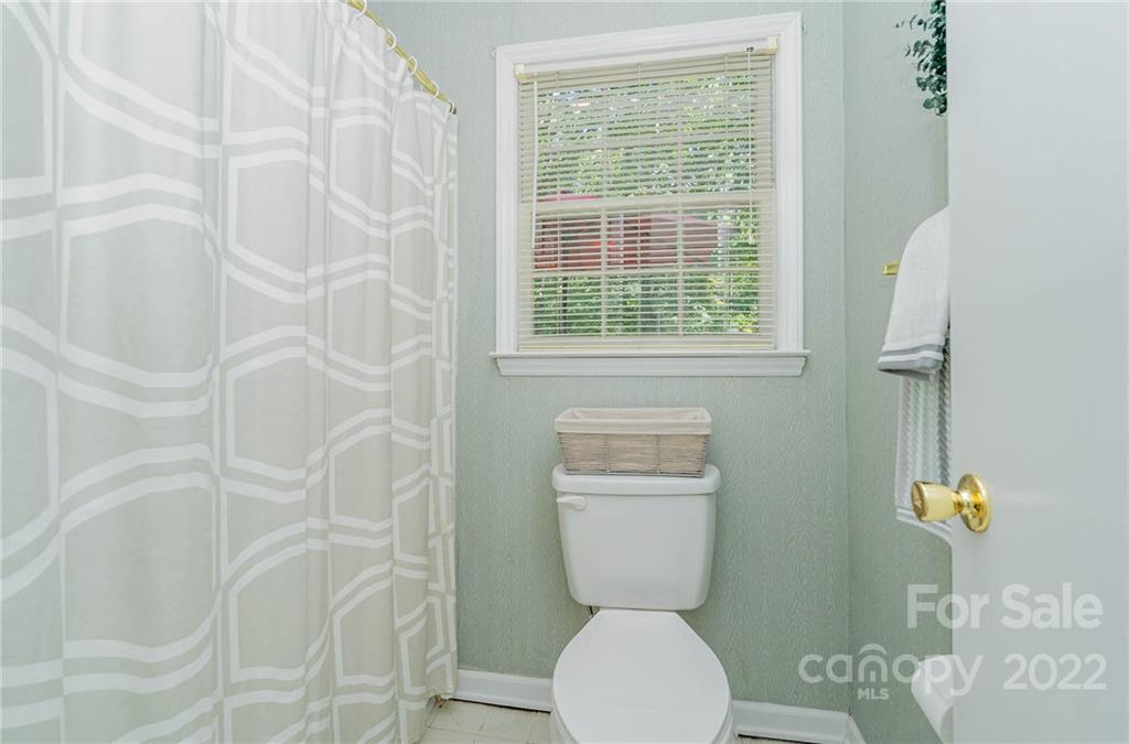 6901 Porterfield Road Charlotte, NC 28226 - Photo 24 of 30 a bathroom with a toilet and a shower