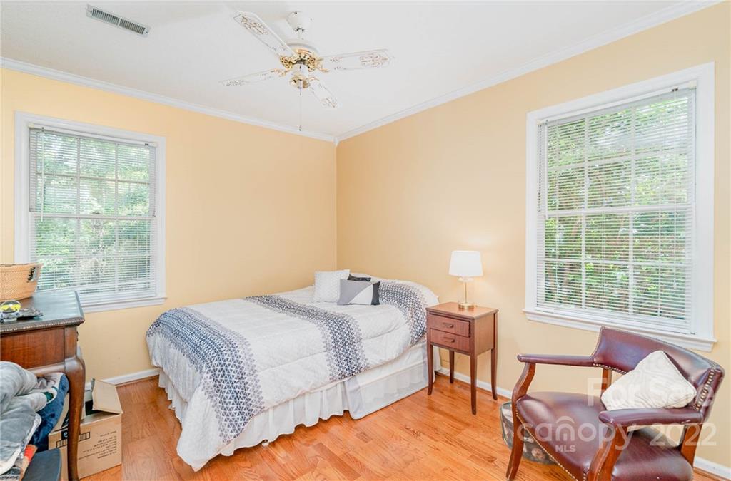 6901 Porterfield Road Charlotte, NC 28226 - Photo 25 of 30 a bedroom with a bed and a table