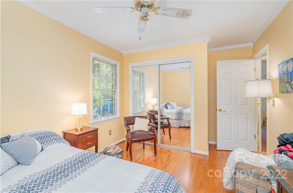 6901 Porterfield Road Charlotte, NC 28226 - Photo 26 of 30 a bedroom with furniture and a large window