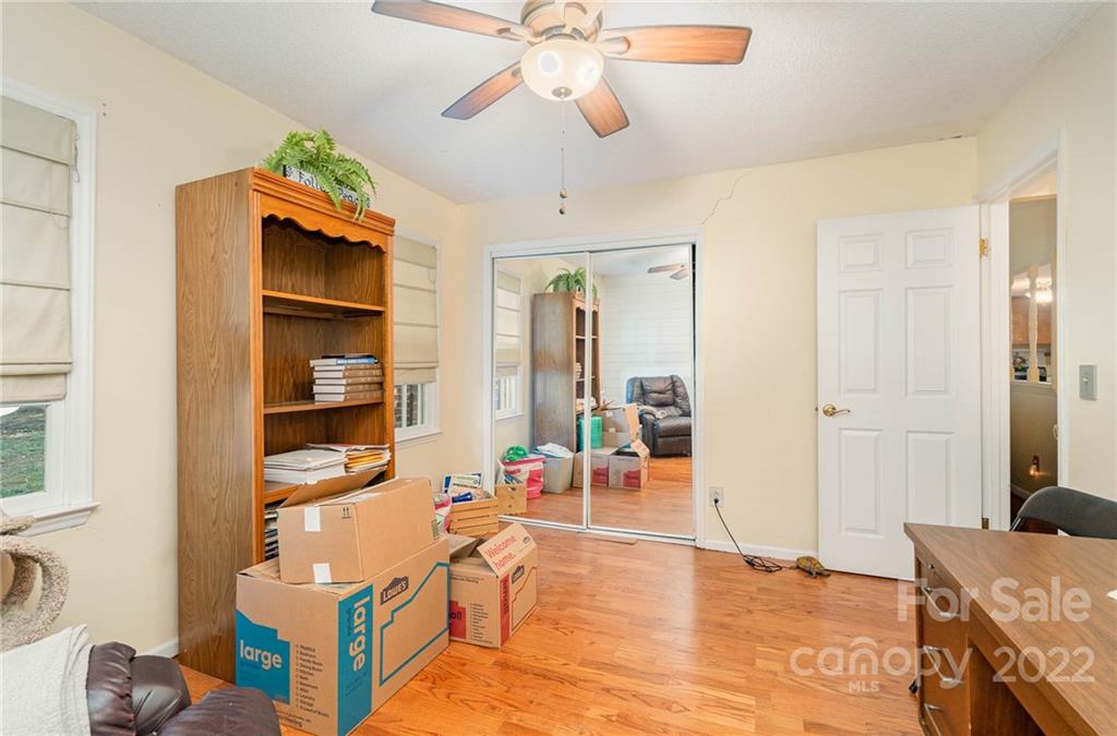 6901 Porterfield Road Charlotte, NC 28226 - Photo 28 of 30 a living room with furniture a dining table and chairs