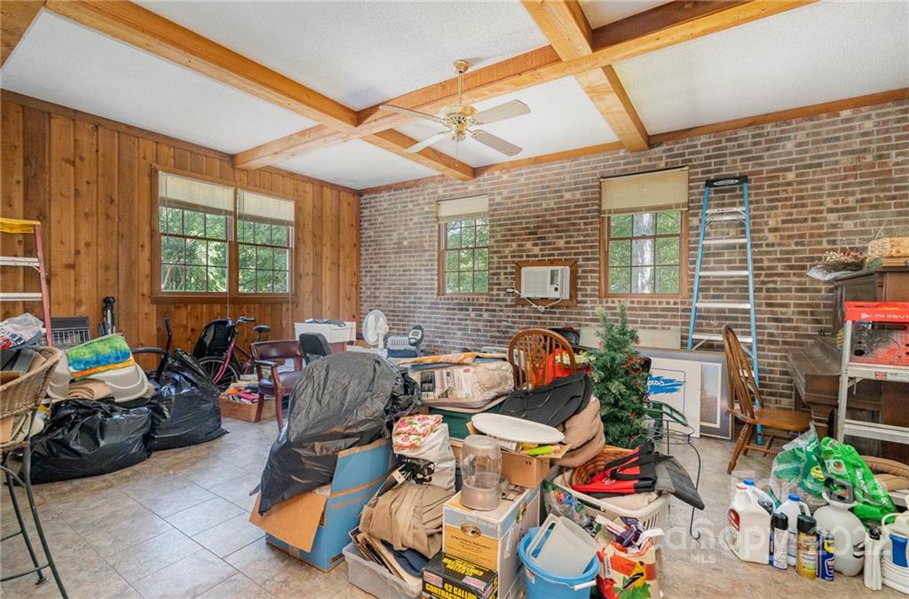 6901 Porterfield Road Charlotte, NC 28226 - Photo 29 of 30 a living room filled with furniture and a chandelier