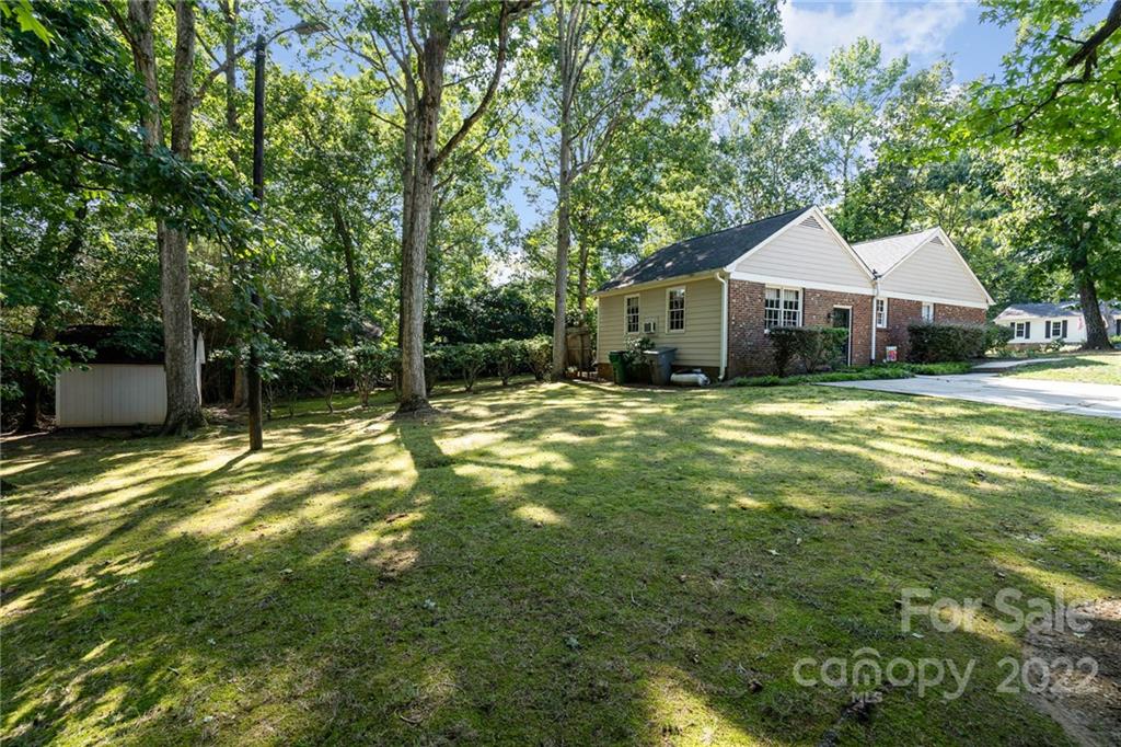 6901 Porterfield Road Charlotte, NC 28226 - Photo 4 of 30 a view of a house with a yard and large trees