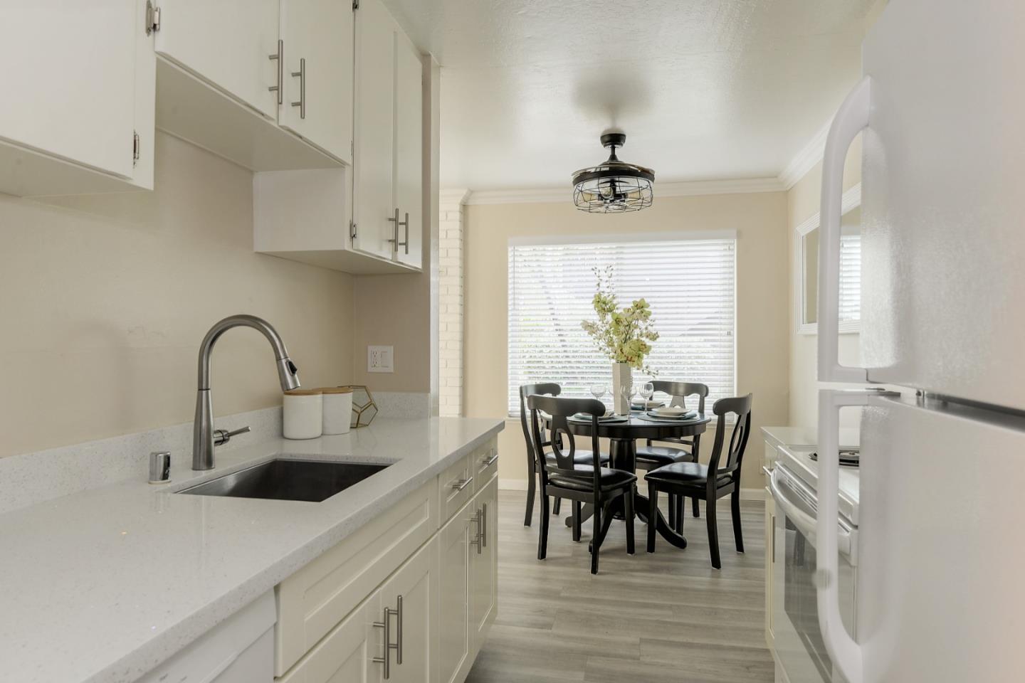 100 East Middlefield Road, Unit 1B Mountain View, CA 94043 - Photo 2 of 18 a view of a dining room with furniture and chandelier